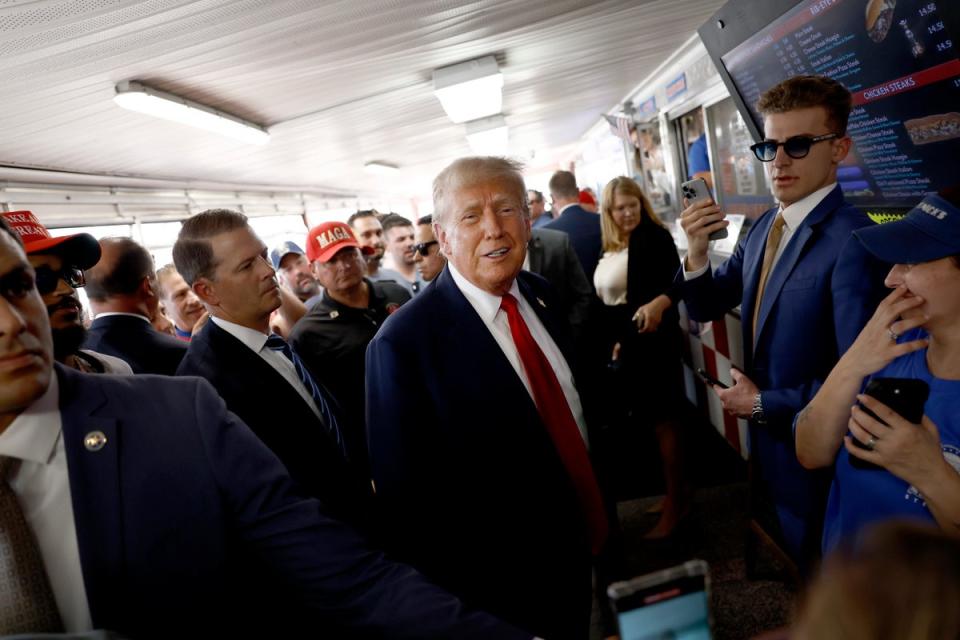 Republican presidential candidate, former president Donald Trump poses for photos with supporters at sandwich stop Tony and Nick’s steaks in Philadelphia. A former Trump confidant says he made Nazi jokes in front of Jewish executives. (Getty Images)