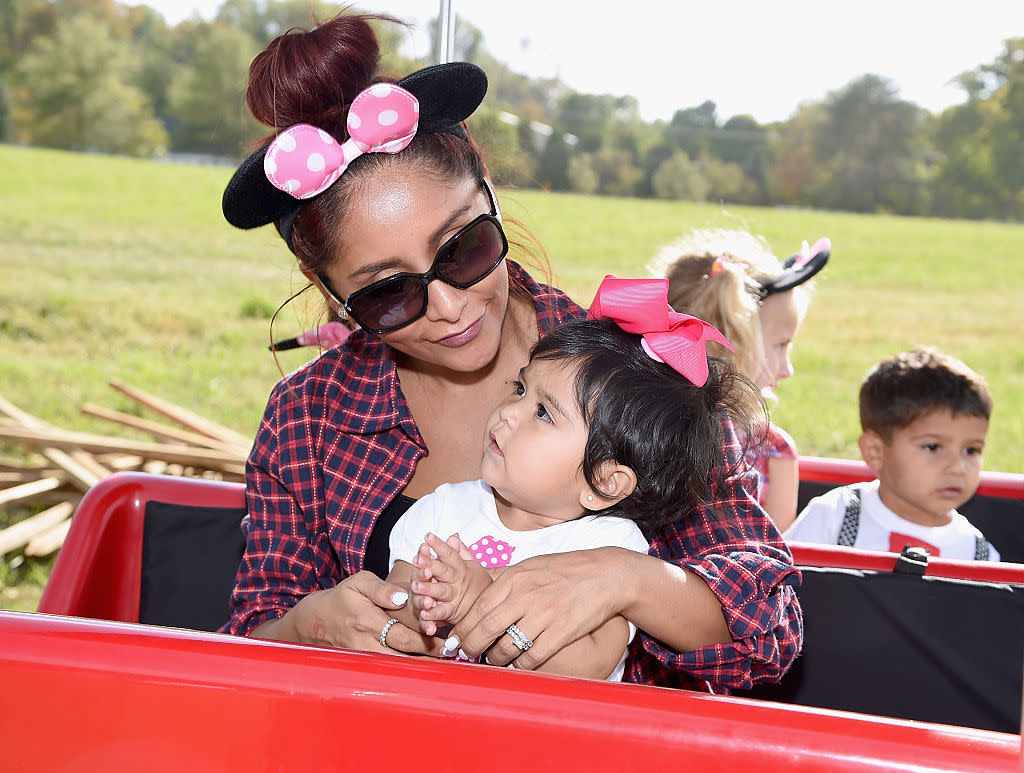 In seven years, Nicole Polizzi has gone from hot mess to hot mama — but she'll always be Snooki. (Photo: Getty Images)