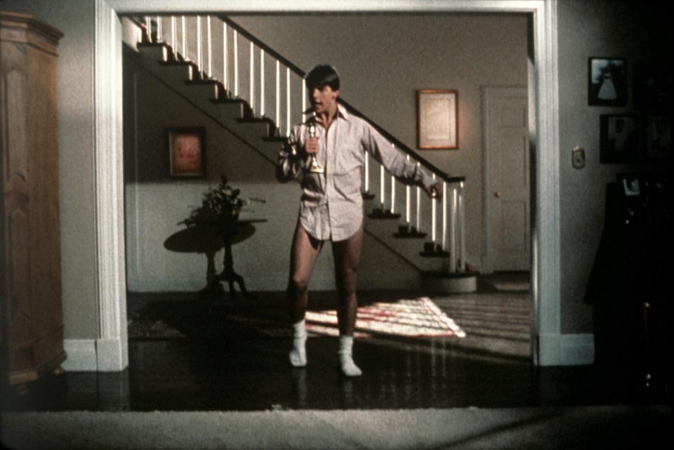 Tom Cruise as Joel Goodson dancing around the house in shirt, socks and underwear in Risky Business. (Warner Bros.)