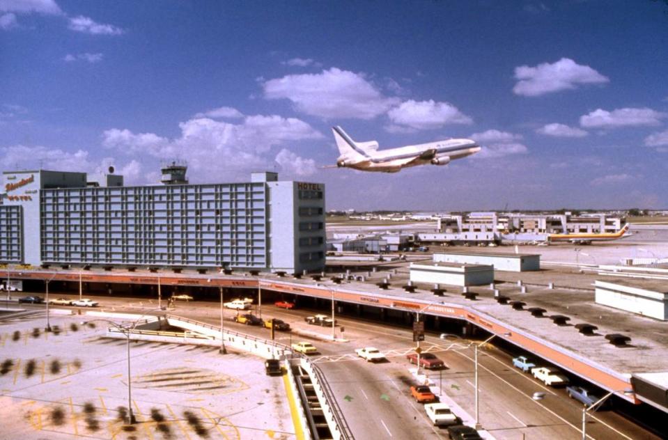 An Eastern Airlines L-1011 TriStar takes off from Miami International Airport. The tower is at left.