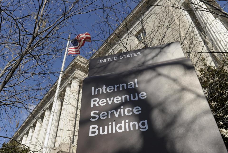 FILE - This March 22, 2013 file photo shows the exterior of the Internal Revenue Service building in Washington. An Internet connection, a tax return form and a stolen identity are enough to fuel a multi-billion-dollar criminal enterprise that has proven too pervasive to stop. Thanks in part to technological simplicity and controls that struggle to keep pace with the crime, thieves are pocketing billions of dollars in stolen federal tax refunds. Over the last year, the IRS paid out $4 billion in bogus tax refunds to fraudsters using someone else’s personal information. (AP Photo/Susan Walsh, File)