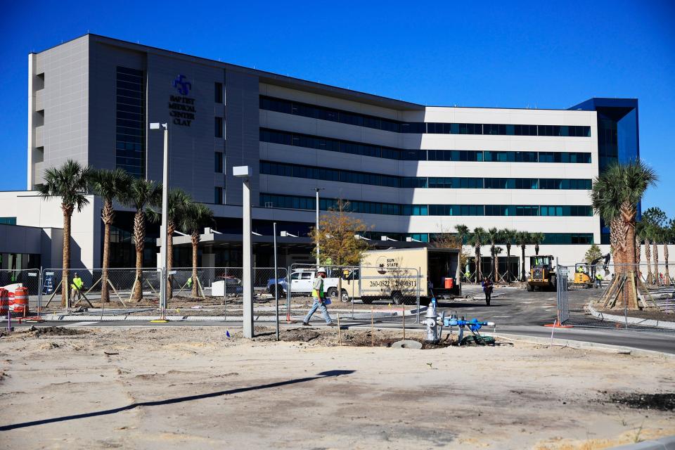 Construction crews complete the outdoor finishing touches at Baptist Medical Center Clay on Fleming Island. The $234 million full-service hospital has six stories and 102 beds and brought 400 new jobs to Clay County.