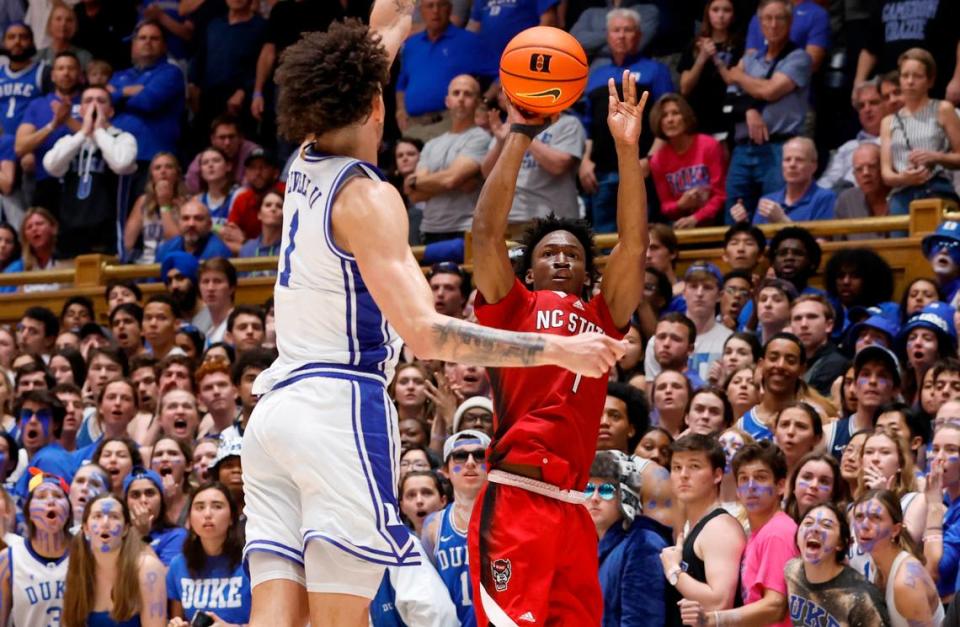 N.C. State’s Jarkel Joiner (1) shoots as Duke’s Dereck Lively II (1) defends during the second half of Duke’s 71-67 victory over N.C. State at Cameron Indoor Stadium in Durham, N.C., Tuesday, Feb. 28, 2023.