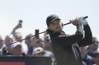 England's Tommy Fleetwood plays his tee shot on the 12th hole during a practice round for the British Open Golf Championships at the Royal Liverpool Golf Club in Hoylake, England, Wednesday, July 19, 2023. The Open starts Thursday, July 20. (AP Photo/Kin Cheung)