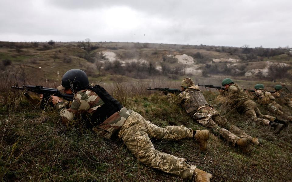 New Ukrainian army brigade recruits practice firing during a military exercise - Violeta Santos Moura/Reuters