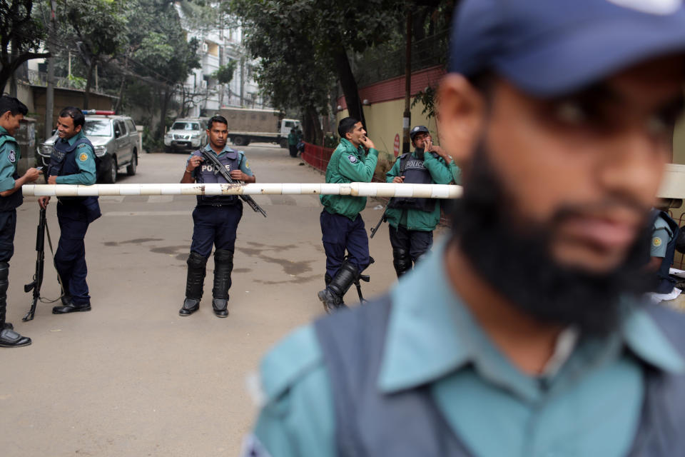 Bangladeshi police stand guard in front of the house of former Prime Minister and main opposition Bangladesh Nationalist Party (BNP) leader Khaleda Zia during a 48-hour nationwide strike called by her party, in Dhaka, Bangladesh, Monday, Jan. 6, 2014. Bangladesh's ruling Awami League won one of the most violent elections in the country's history, marred by street fighting, low turnout and a boycott by the opposition that made the results a foregone conclusion. (AP Photo/A.M. Ahad)