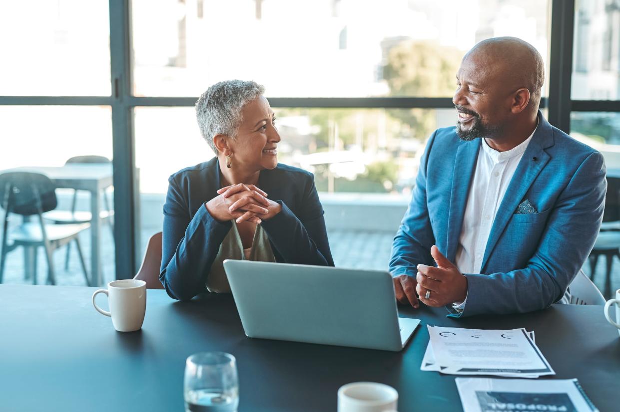 Leadership, management and teamwork between CEO and senior manager in a business meeting in the office. Leader and boss working as a team to plan the vision and mission for growth and development