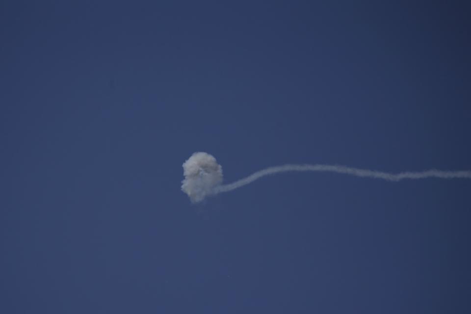 Smoke from an Israeli Iron Dome air defense system intercept rockets fired from Gaza over Sderot, southern Israel, Wednesday, Nov. 13, 2019. (AP Photo/Ariel Schalit)