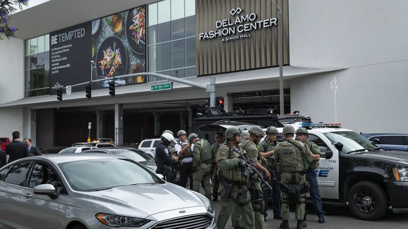 Members of the El Segundo Police Department keep watch on Del Amo Circle in Torrance, outside the entrance to the Del Amo Fashion Center, where a shooting took place on June 3, 2019. (Credit: Mel Melcon / Los Angeles Times)