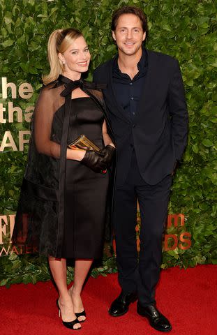 <p>Dia Dipasupil/WireImage</p> Margot Robbie and Tom Ackerly