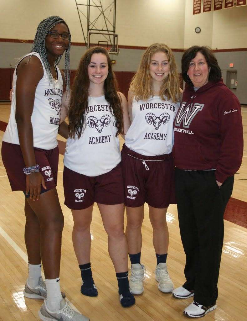 Worcester Academy girls' basketball coach and former Holy Cross standout Sherry Levin, right, stands with WA captains Aliyah Boston, Kiera Fernandes and Lauren Power at the beginning of the 2018-19 season.