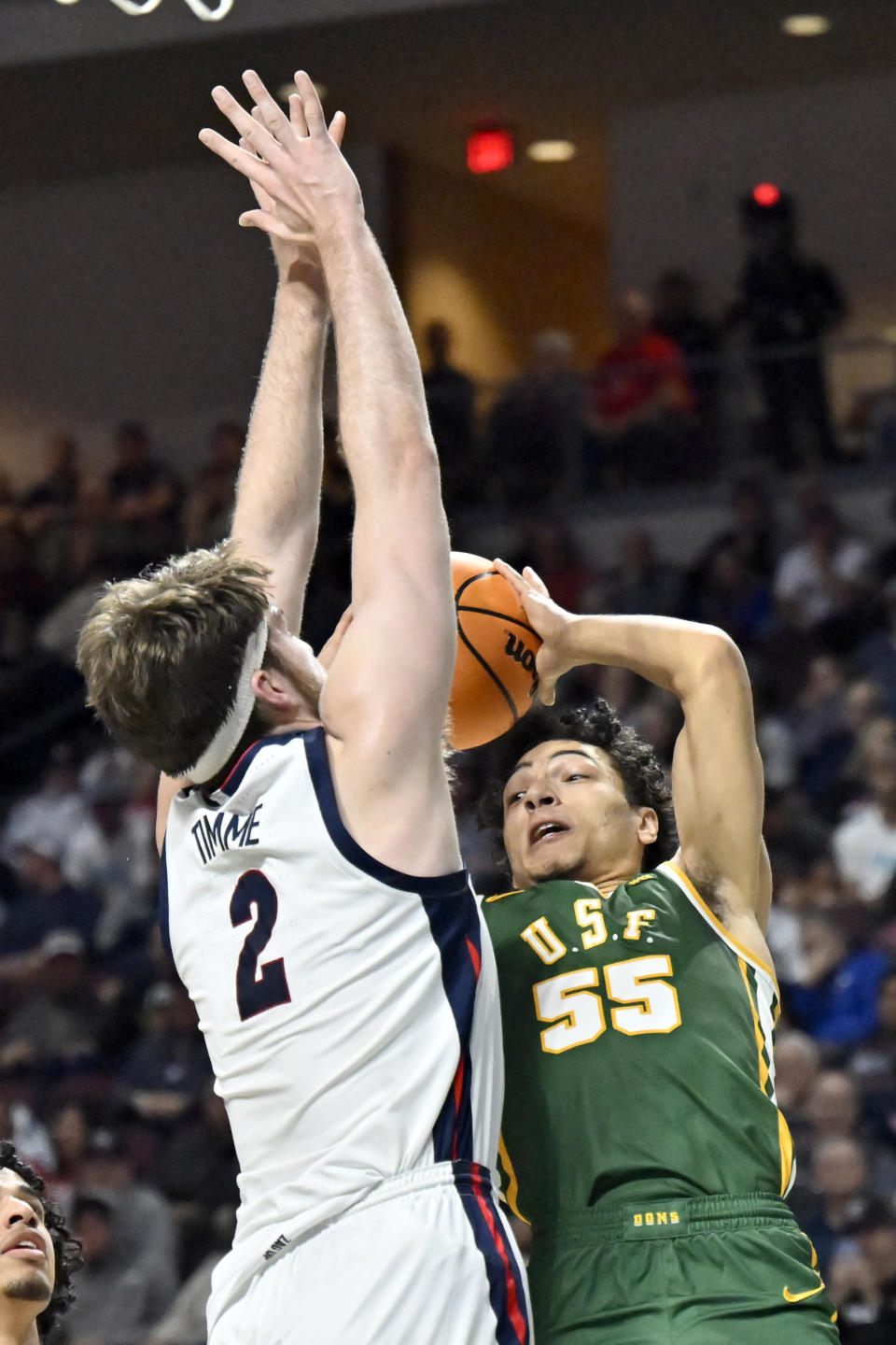 San Francisco guard Marcus Williams (55) shoots against Gonzaga forward Drew Timme (2) during the first half of an NCAA college basketball game in the semifinals of the West Coast Conference men's tournament Monday, March 6, 2023, in Las Vegas. (AP Photo/David Becker)