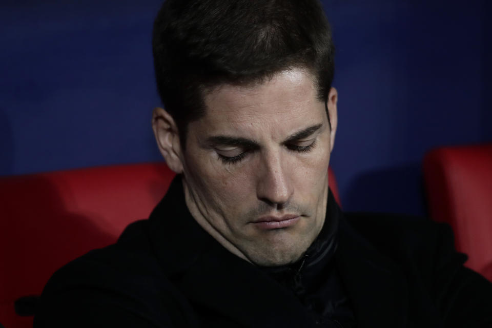 Spain head coach Robert Moreno sits on the bench during the Euro 2020 group F qualifying soccer match between Spain and Romania at the Metropolitano stadium in Madrid, Monday, Nov. 18, 2019. (AP Photo/Manu Fernandez)