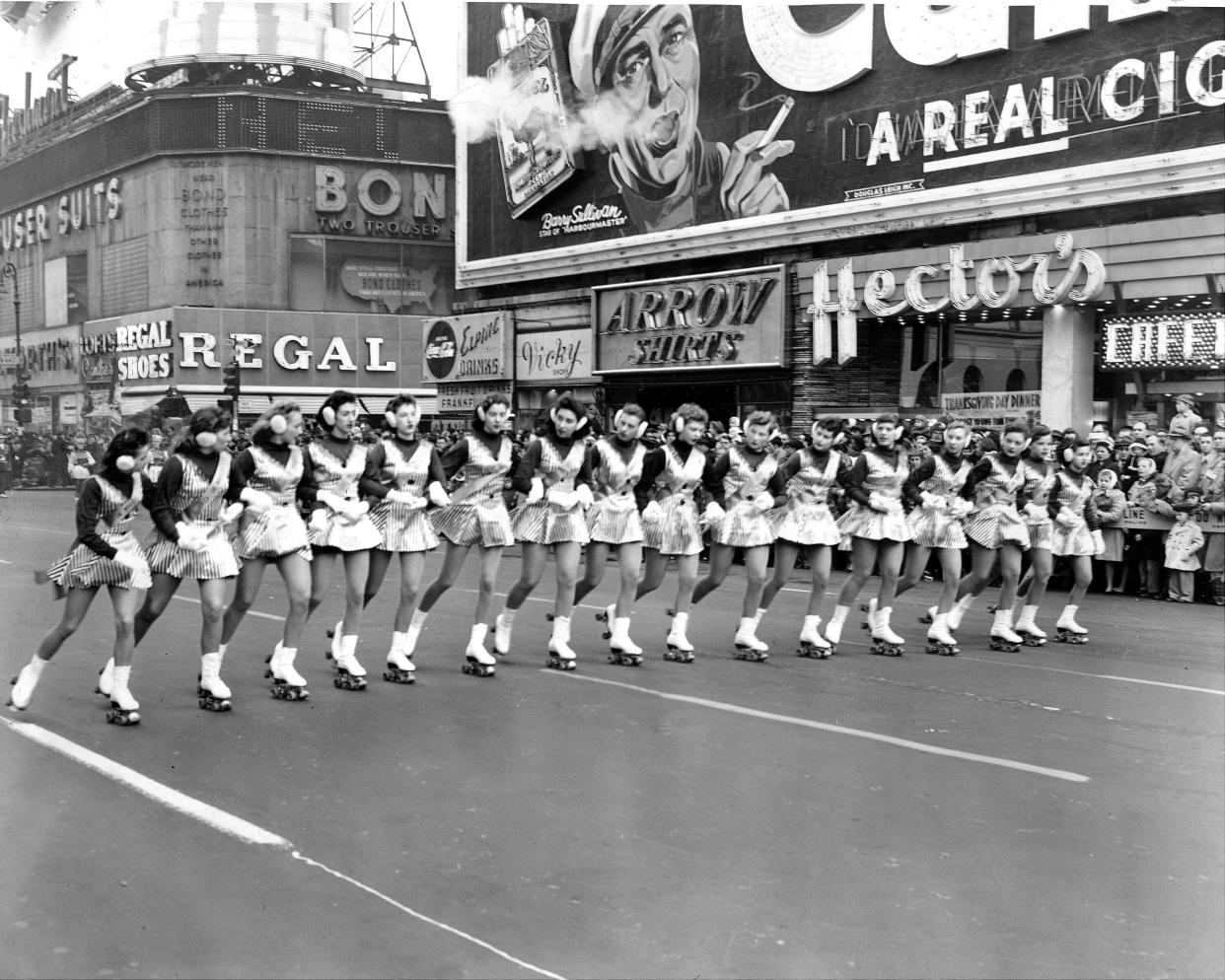 A line of skaters rolling down Broadway