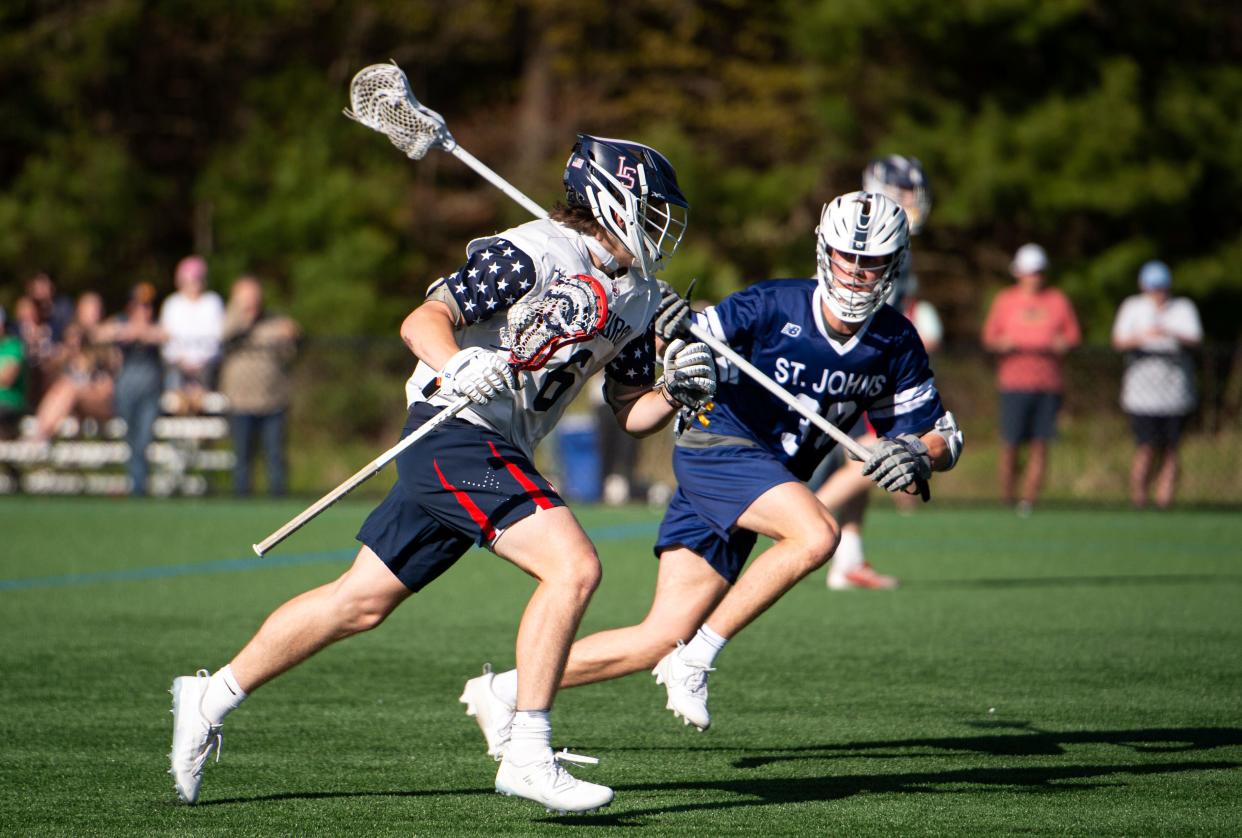 Lincoln-Sudbury junior Nolan Martindale works his way towards the St. John’s Prep net during the game in Sudbury, May 7, 2024. The Eagles defeated the Warriors, 10-6.