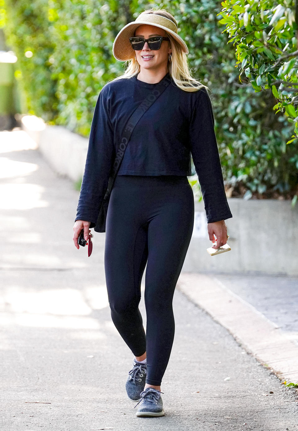 <p>Hilary Duff stays protected from the sun during a stroll in Los Angeles on Jan. 26.</p>