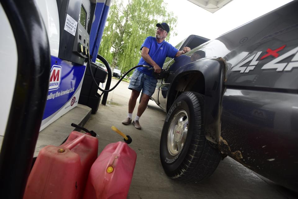 Croswell resident Larry Hall fills up his GMC pickup truck at the Marathon gas station on Main Street in Lexington on Monday, June 6, 2022. Hall arrived at 7 a.m. to be one of the first people in line as he planned to put 15 gallons in his pickup truck and fill two five-gallon gas cans for his lawnmower.