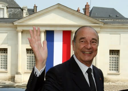 FILE PHOTO: France's President Jacques Chirac waves as he leaves a French naturalization ceremony in Tours