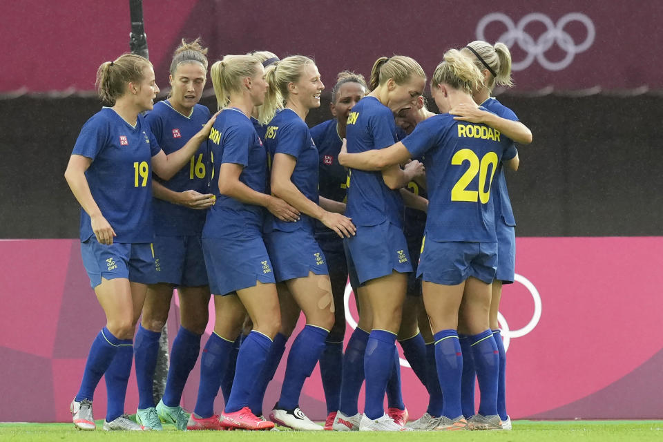 Sweden's players celebrate after Sweden's Madelen Janogy scores a goal against New Zealand during a women's soccer match between New Zealand and Sweden at the 2020 Summer Olympics, Tuesday, July 27, 2021, in Rifu, Japan. (AP Photo/Andre Penner)