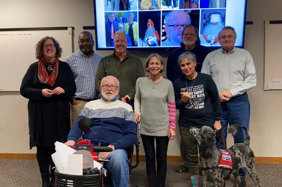 Holland City Council members pose for a picture with Frank Kraai, front left, whose donation of $1 million to the city's ice rink project was announced Wednesday. From back left, Lyn Raymond, Quincy Byrd, Nathan Bocks, Dave Hoekstra, Jay Peters. Front: Kraai, Nicki Arendshorst and Belinda Coronado.