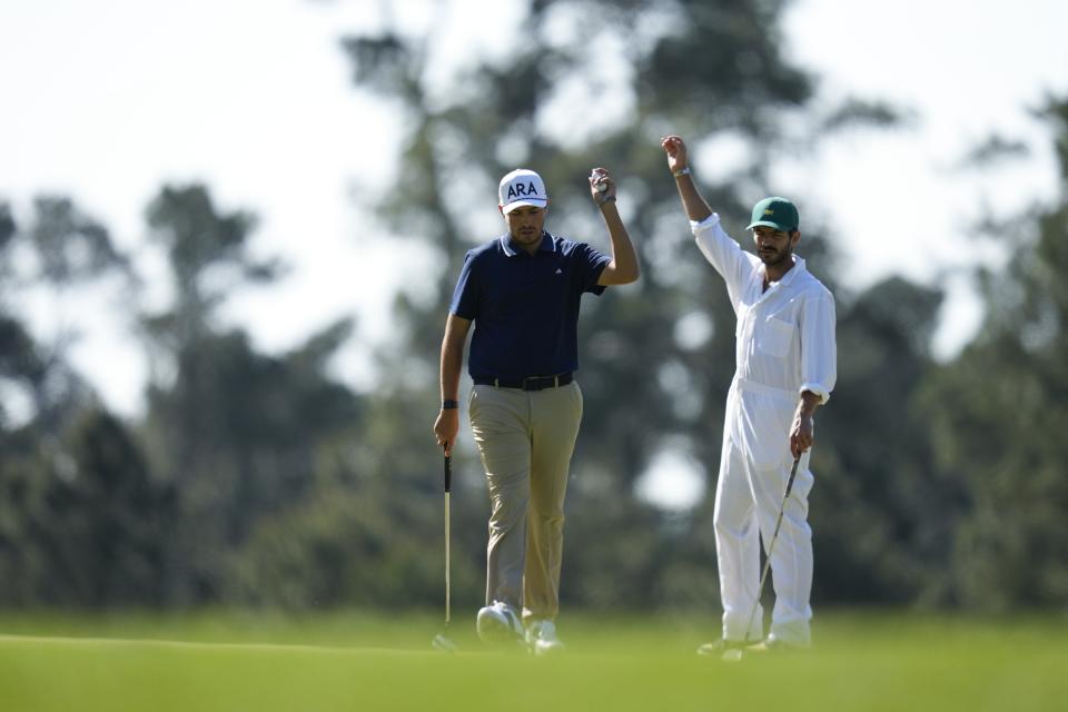 Santiago De la Fuente, of Mexico, and his caddie react on the third green during a practice round in preparation for the Masters golf tournament at Augusta National Golf Club Monday, April 8, 2024, in Augusta, Ga. (AP Photo/Ashley Landis)