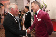 Britain's Prince Charles, left, meets some of the cast including actor Daniel Craig, right, at the world premiere of the new James Bond film "No Time To Die" at Royal Albert Hall in London, Tuesday, Sept. 28, 2021. (Chris Jackson/Pool Photo via AP)