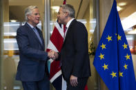 UK Brexit secretary Stephen Barclay, right, is welcomed by European Union chief Brexit negotiator Michel Barnier before their meeting at the European Commission headquarters in Brussels, Friday, Oct. 11, 2019. (AP Photo/Francisco Seco, Pool)