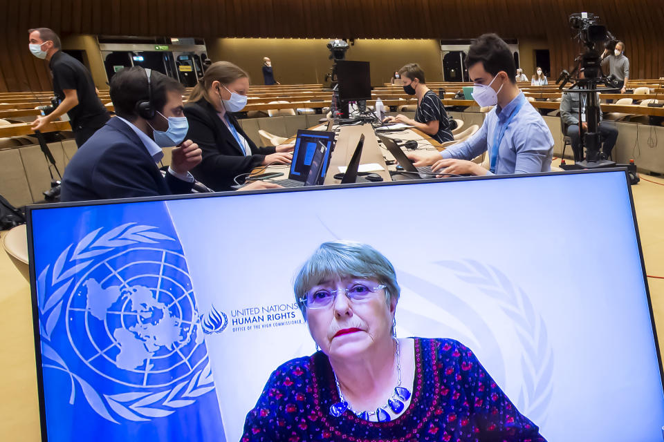 CORRECTING DATE TO 27 - UN High Commissioner for Human Rights Michelle Bachelet, is displayed on a screen as she delivers her speech during a special session of the UN Human Rights Council to discuss situation in the Occupied Palestinian Territory, at the European headquarters of the United Nations in Geneva, Switzerland, Thursday, May 27, 2021. (Martial Trezzini/Keystone via AP)