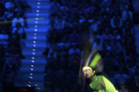 In this photo taken with slow shutter speed, Spain's Rafael Nadal returns the ball to Norway's Casper Ruud during their singles tennis match of the ATP World Tour Finals, at the Pala Alpitour in Turin, Italy, Thursday, Nov. 17, 2022. (AP Photo/Antonio Calanni)