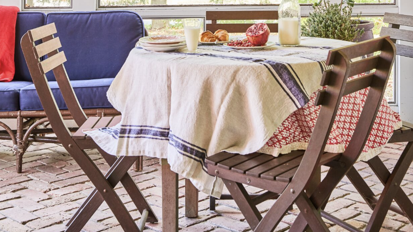 porch with circle table and brown chairs