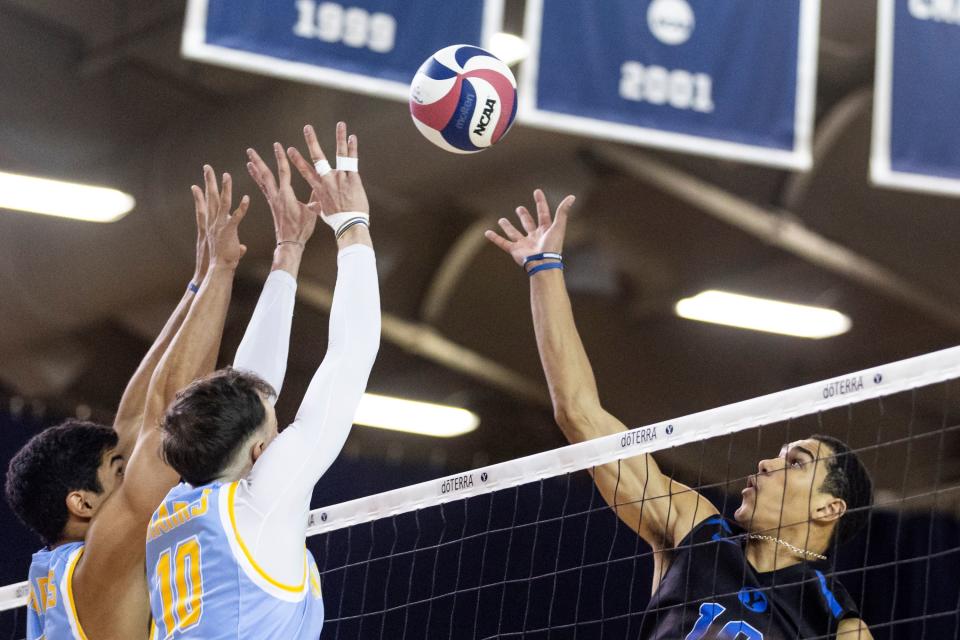 Brigham Young Cougars middle blocker Gavin Julien (10) blocks a shot against Long Island Sharks outside hitter Gil Collazo (4) and middle blocker Arthur Sueur (10) during an NCAA men’s volleyball match at the Smith Fieldhouse in Provo on Thursday, Feb. 8, 2023. | Marielle Scott, Deseret News