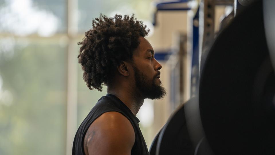 Memphis senior Jordan Brown works out inside the D.D. Spurlock Weight Room at the Laurie-Walton Family Basketball Center.
