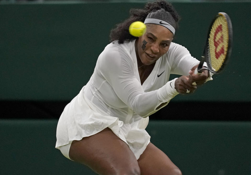 Serena Williams of the US returns to France's Harmony Tan in a first round women's singles match on day two of the Wimbledon tennis championships in London, Tuesday, June 28, 2022. (AP Photo/Alberto Pezzali)