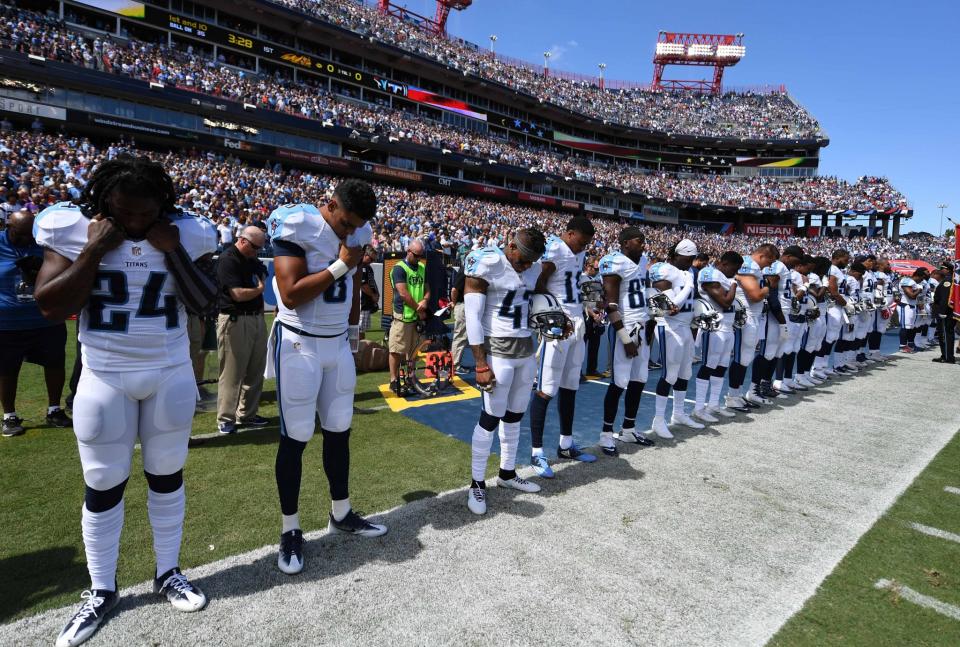<p>Tennessee Titans players observe a moment of silence before the game against the Minnesota Vikings at Nissan Stadium. Mandatory Credit: Christopher Hanewinckel-USA TODAY Sports </p>