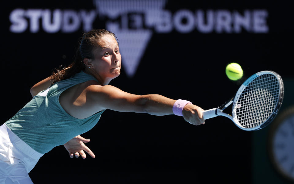 Russia's Daria Kasatkina makes a backhand return to Aryna Sabalenka of Belarus during their second round match at the Australian Open tennis championship in Melbourne, Australia, Wednesday, Feb. 10, 2021.(AP Photo/Rick Rycroft)