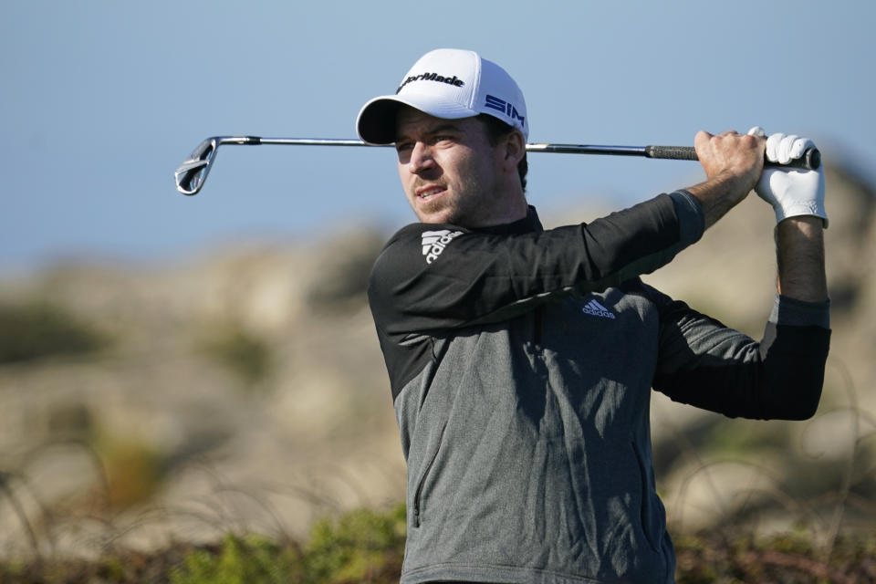 Nick Taylor follows his shot from the ninth tee of the Monterey Peninsula County Club Shore Course during the first round of the AT&T Pebble Beach National Pro-Am golf tournament Thursday, Feb. 6, 2020, in Pebble Beach, Calif. (AP Photo/Tony Avelar)