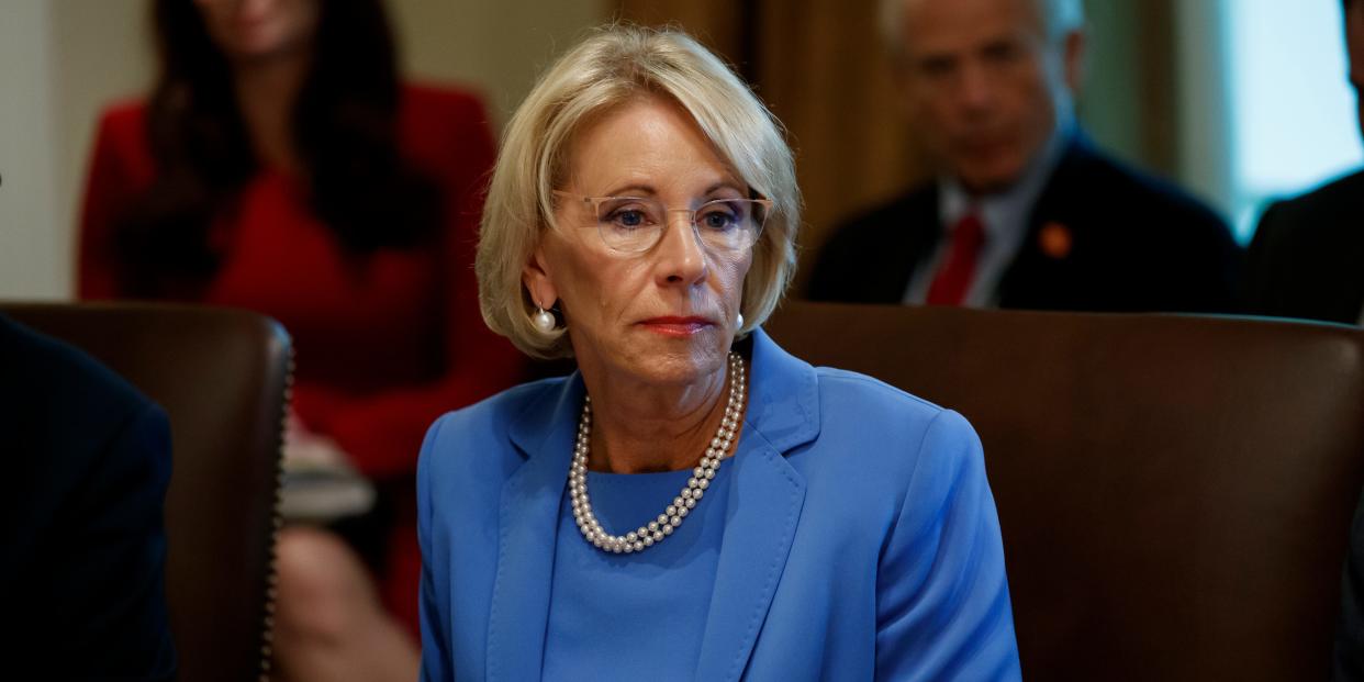 FILE - In this July 16, 2019, file photo, Education Secretary Betsy DeVos listens during a Cabinet meeting in the Cabinet Room of the White House in Washington. The Trump administration is threatening to cut grant funding to a Middle East studies program at the University of North Carolina and Duke University, saying it’s misusing federal funding to advance “ideological priorities” and unfairly promotes “the positive aspects of Islam” but not Christianity or Judaism. (AP Photo/Alex Brandon, File)