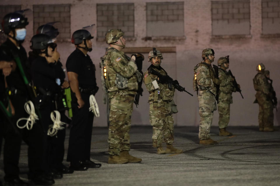 Heavily armed National Guardsmen join Los Angeles police officers during protests Sunday over the death of George Floyd at the hands of police in Minneapolis on May 25. (Photo: ASSOCIATED PRESS)