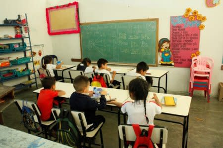 Children attend classes at a school in San Cristobal, Venezuela February 20, 2018. Picture taken February 20, 2018. REUTERS/Carlos Eduardo Ramirez