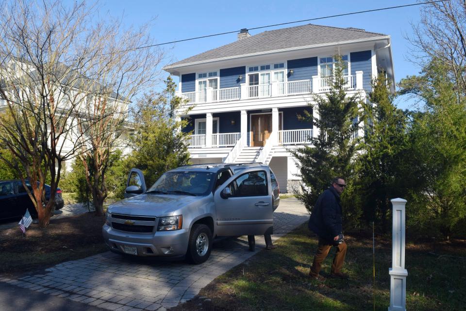 U.S. Secret Service agents are seen in front of Joe Biden's Rehoboth Beach, Del., home on Jan. 12, 2021.