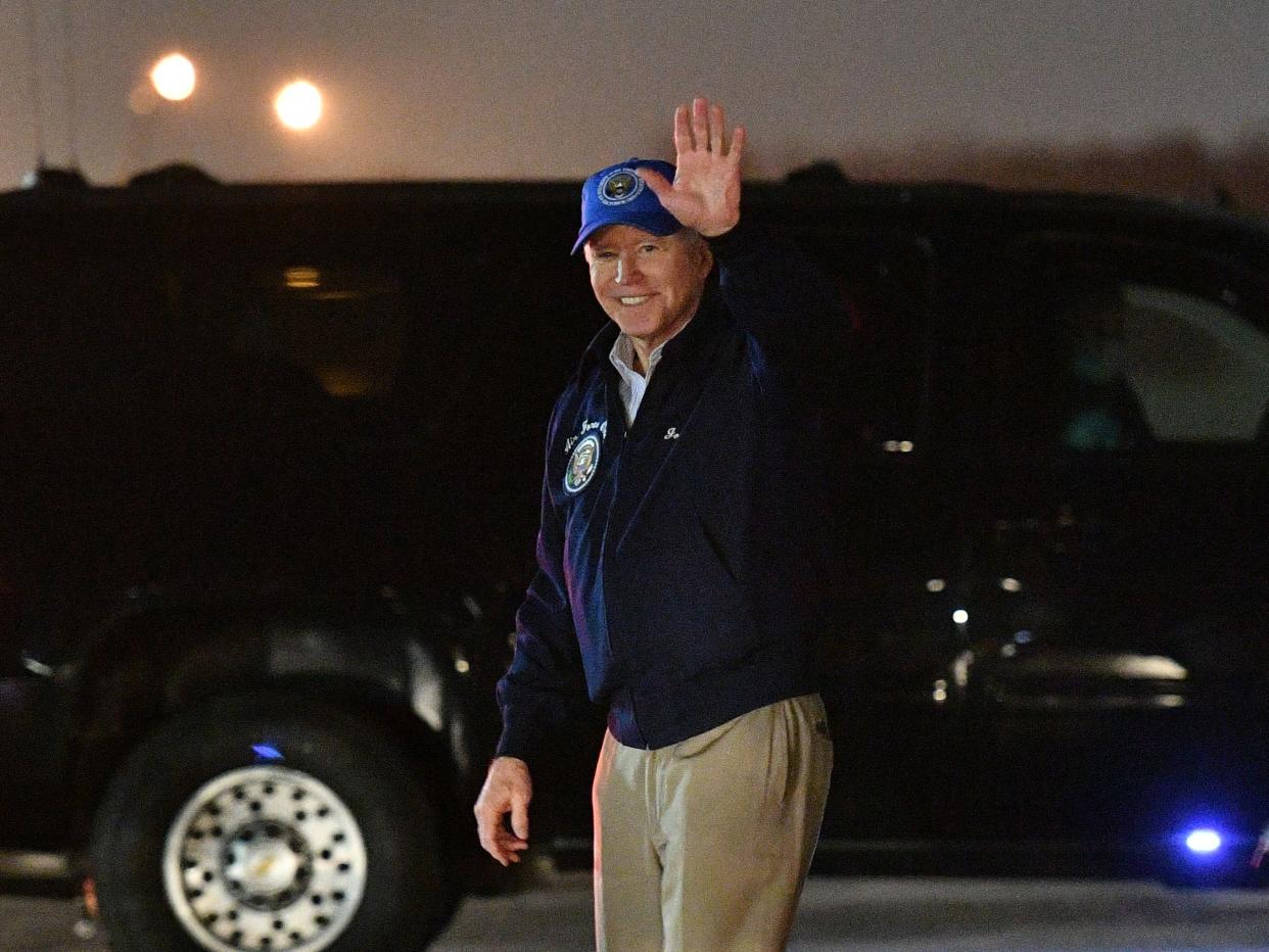 President Joe Biden waves upon arrival at Andrews Air Force Base in Maryland on February 26, 2021. (AFP via Getty Images)