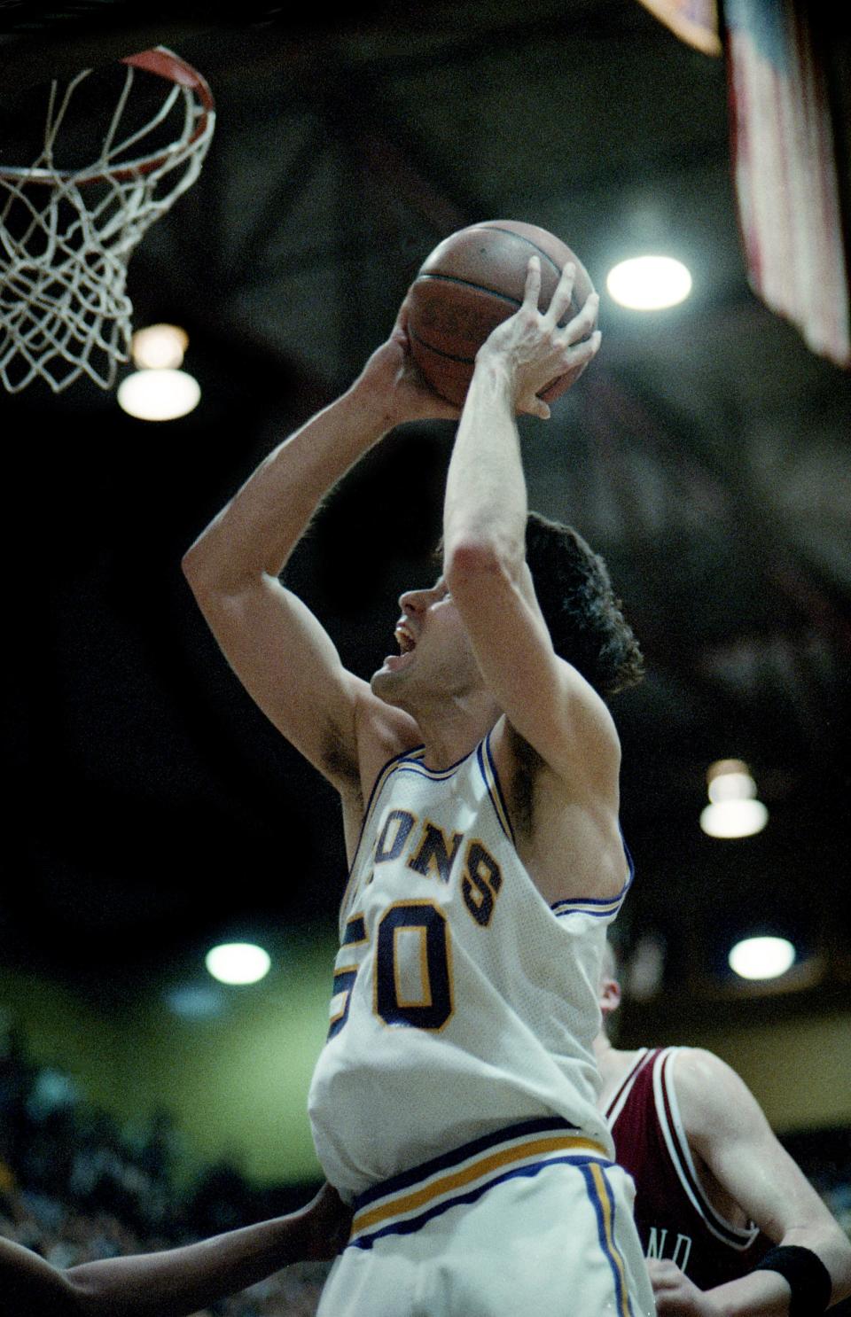 David Lipscomb standout John Pierce (50) goes up for the basket that tied him with Phillip Hutcheson, a former Lipscomb standout, as college basketball’s all-time leading scorer for a career at 4,106 in the Bisons’ 119-102 victory over Cumberland in a packed McQuiddy Gym on Feb. 24, 1994. Pierce finished with 4,110 to take over the top spot.
