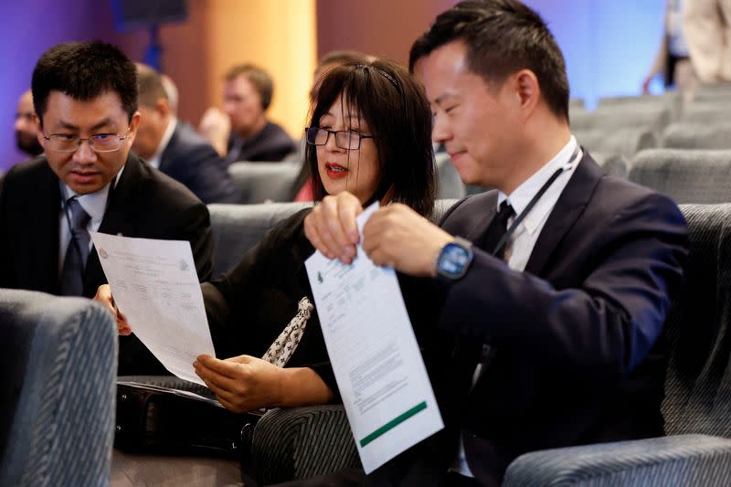 FILE PHOTO: Representatives of energy firms from around the world attend the fifth plus and sixth licensing rounds for 29 oil and gas exploration blocks at the Oil Ministry's headquarters in Baghdad