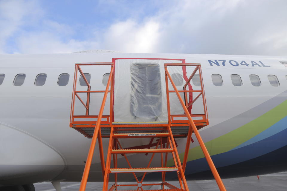 This photo released by the National Transportation Safety Board shows a gaping hole where the paneled-over door had been at the fuselage plug area of Alaska Airlines Flight 1282 on Sunday, Jan. 7, 2024, in Portland, Ore. A panel used to plug an area reserved for an exit door on the Boeing 737 Max 9 jetliner blew out Jan. 5, shortly after the flight took off from Portland, forcing the plane to return to Portland International Airport. (National Transportation Safety Board via AP)