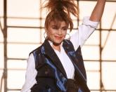 <p>Paula Abdul dominated the dance floor wearing hoops and a flashy blue vest in the "Forever Your Girl" music video. </p>