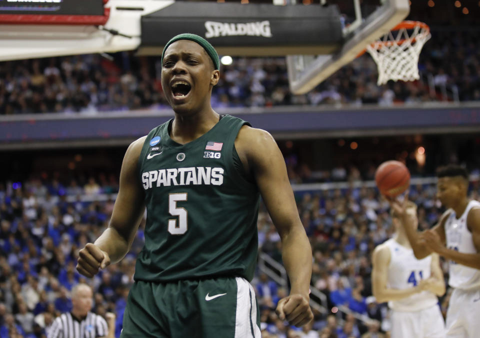 Michigan State guard Cassius Winston (5) reacts to scoring on Duke during the first half of an NCAA men's East Regional final college basketball game in Washington, Sunday, March 31, 2019. (AP Photo/Alex Brandon)