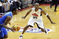 In this photo provided by the Las Vegas News Bureau, United States Olympic men's basketball team member Kobe Bryant (10) guards Dominican Republic's Gerardo Suero during an exhibition game, Thursday, July 12, 2012, in Las Vegas. The U.S. won 113-59. (AP Photo/Las Vegas News Bureau, Brian Jones)