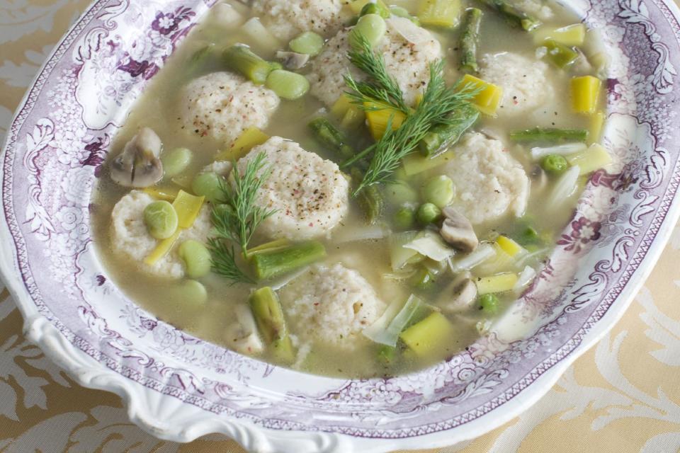 In this March 4, 2013 photo, spring vegetable soup with low-fat, high-flavor matzo balls is shown in a soup tureen in Concord, N.H. (AP Photo/Matthew Mead)