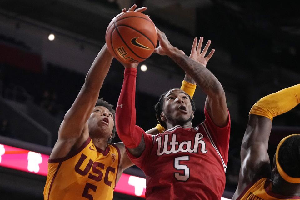 Utah guard Deivon Smith, has his shot blocked by Southern California guard Boogie Ellis during the second half of an NCAA college basketball game Thursday, Feb. 15, 2024, in Los Angeles. | Mark J. Terrill, Associated Press