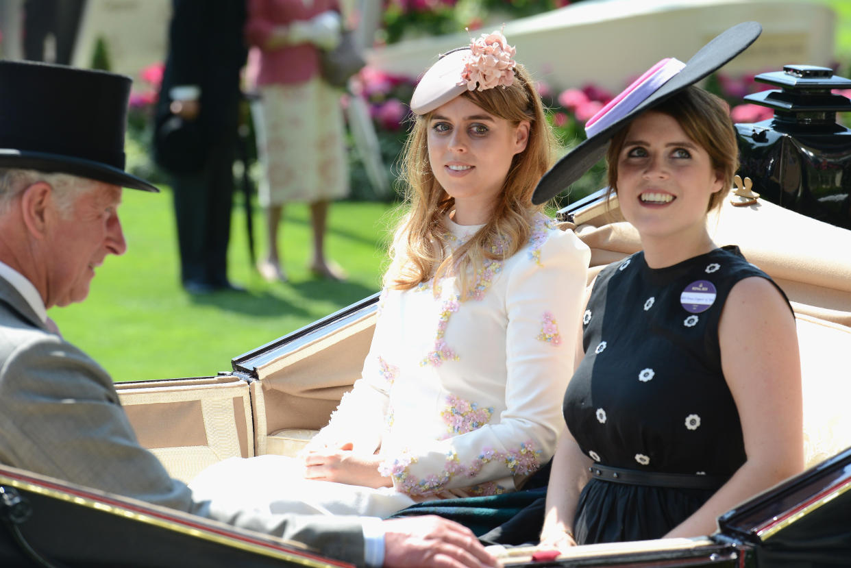 King Charles - as he's now known - with Princess Beatrice of York and Princess Eugenie of York at Ascot in 2017. (Getty Images)